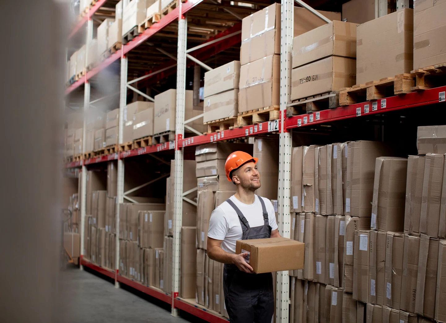 Warehouse team handling a packed consignment